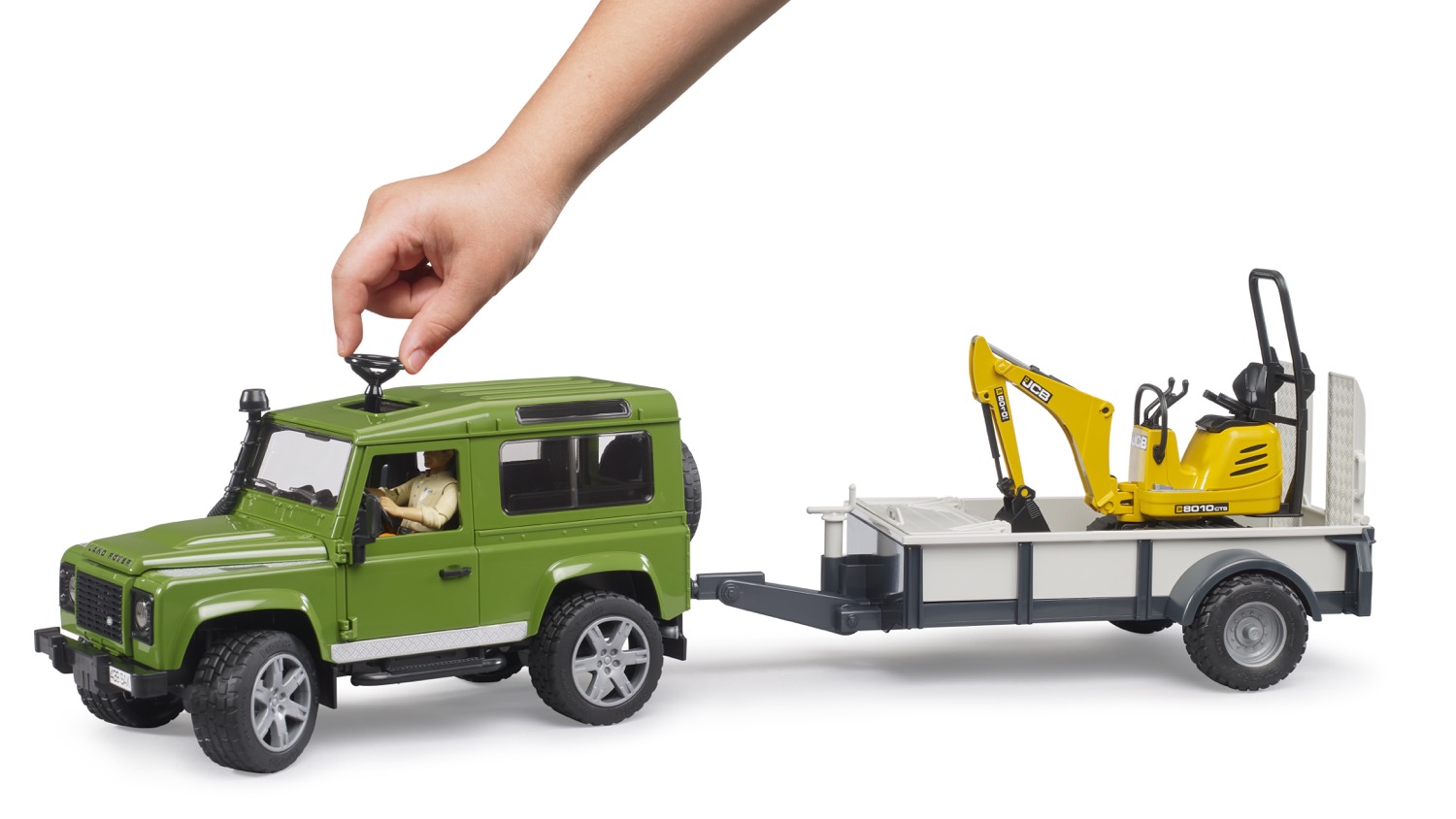 Land Rover Defender Station Wagon mit Einachsanhänger - JCB Mikrobagger 8010 CTS und Bauarbeiter Modell von Bruder 1:16