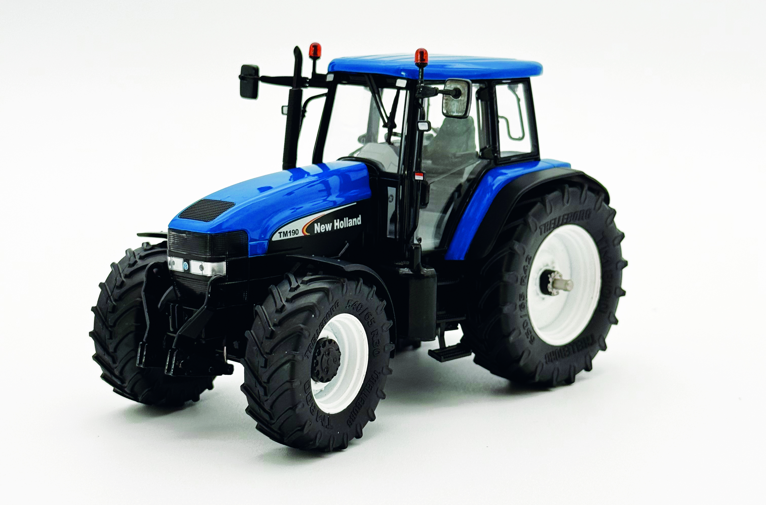 New Holland TM 190 G1 mit Fronthydraulik Modell von Ros 1:32
